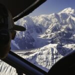 Pilot navigates Denali National Park via airplane with the summit in the background